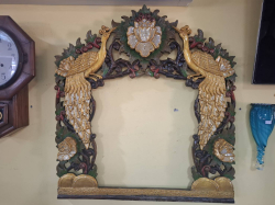 Vintage oak framed mirror frame depicting peacock. Approx. 88x82 cm