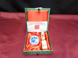 A soapstone foo dog seal with a dragon decorated ink pot in original box