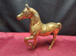 A Good Brass Model of a Prancing Horse. L.23 H.21 Cm.