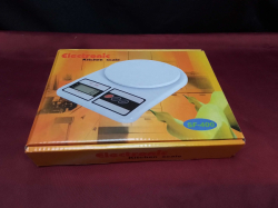 An electric kitchen scale new with battery.