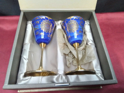 A pair of art wine brass glasses in a box