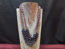 A Lovely Handmade Wood Necklace with Purple and coral pink Beads.(Stand not included)