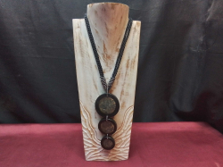A Black Cord Necklace with three large circular pendants a textured (possibly Stone or Resin inlay) (Stand not included)