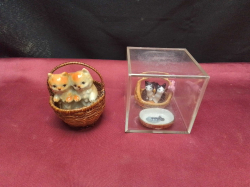 A Limoges small Hand Crafted porcelain in case 7x7 Cm. and a couple cat in basket 6x7 Cm.