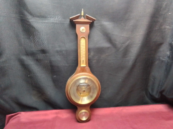 A Good Wall Barometer and Thermometer in A Mahogany Case. W.17 H.55 Cm.