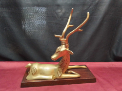 A Very Old large  Brass Stag on A Hardwood Stand  Nicely Sculptured in good condition 34 Cm. High 33 Cm. Wide Easily made into a Lamp.