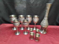 A Beautiful set of 6 Pewter wine Cups and a Pewter Vase and 4 Small Measurs All Carved with  Elephants.