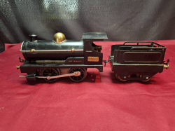 A Hornby by O Gauge0-4-0 clockwork Locomotive number 2710 and tender 1924 