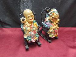 2  Old Chinese people in rocking chairs heavy 