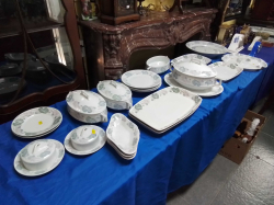 A Large set of German  Porcelain Dinnerware including 3 Tureens 4 Rectangular meat plates and other dishes (24 Pieces)
