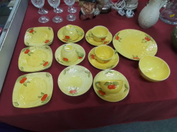An Art Deco Yellow Tea Set with Emossed Cherry Decoration. 19 Pieces.