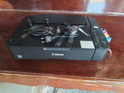 CANNON Printer with refill color tank and 2 cables.