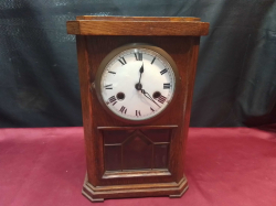 A Small Oak Mantle Clock. D.14 H.31 H.31 Cm.