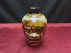 A lovely double sided foo dog vase 15 cm tall.  