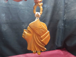 A wooden hand carved wall plaque showing a ladies face 17x20 Cm. 