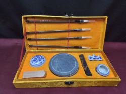 AN VINTAGE TRADITIONAL CHINESE CALLIGRAPHY SET, INK STONE, INK STICK, SEAL INK PAD AND PORCELAIN BRUSH WASHER AND BRUSH REST. NEVER USED. 