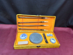 AN VINTAGE TRADITIONAL CHINESE CALLIGRAPHY SET, INK STONE, INK STICK EEAL INK PAD AND PORCELAIN BRUSH WASHER AND BRUSH REST. NEVER USED. 