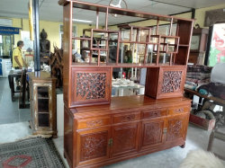 A very good quality beautiful double sided Oriental Chinese display cabinet  Probably made out of Rosewood or Cherrywood decorated all around and carved with cherry blossom and birds. W.183 D.49 H.200 Cm.