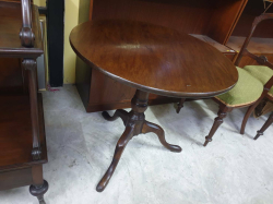 An English George III circa 1760-1780 mahogany one piece top supper table with Gunbarrel column standing on the original Cabrio pod for legs. W.77 H.69 Cm.