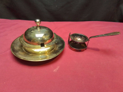  A Silver Plate  Ashtray and Tea Strainer with drip tray.