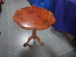 A Round Walnut Table on Tripod Base. W.55 H.60 Cm.
