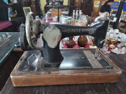 An Old Singer Hand Sewing Machine 