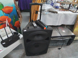 A Large Multimedia Speaker with Remote and 2 Microphones.