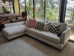 A Large L Shaped Upholstered Seater Sofa with 7 Cushions. D. 107 W. 320 H.86 Cm 