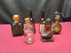 6 Assorted bottles for display including one shaped as Napoleon and one with a lion stopper 