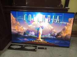 HISENSE 65 Smart TV with Wall Bracket and remote Control.