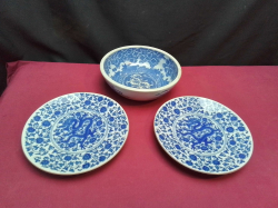 A very old Chinese blue and white bowl W.19 H.7 Cm.and two Chinese blue and white plates decorated with dragons. W.19 Cm.