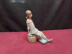 A LLADRO Figure of Girl with Mother's Shoe. W.16 H.19 Cm.