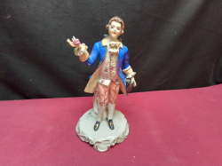 A Late 19th Century Figurine of A Young Man in Blue Costume. W.12 H.23 Cm.