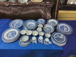 A Large Quantity of Old Blue and White Willow Pattern  Tea Set and Dinner Ware. 64 Pieces.