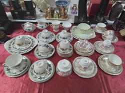 A Gilt and White English Tea Set and a Royal Doulton Tea Set in Green. (50 Pieces)