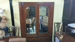 A late Victorian C,1885 mahogany inlaid wardrobe with original mercury beveled edge mirror doors and two drawers below with original handles brass hooks inside. This beautiful wardrobe comes in four part so can be easily moved or transported. W.151 D.58 H