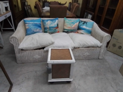 An Old 3 Seater Rattan D.90 W.195 H.80 Cm. with  Cushions and small Storage Box 39x39 H.48 Cm.
