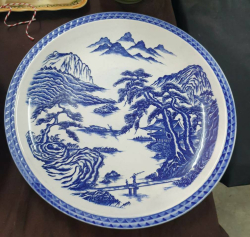 A large oriental blue and white porcelain charger in good condition. W.38 Cm.