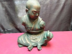 A very large Fiber statue of a sat oriental figure. W.27 H.32 Cm.