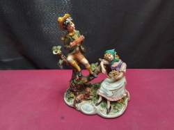 A Large Signed Capodimonte Figural Group. W.18 H.22 Cm.