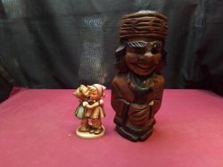 A Well Modelled small figure of a lady and a carvedwooden figure.