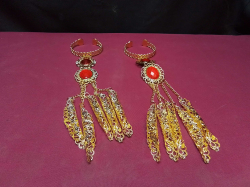 A Pair of Gold Vintage Style Red Beaded Stone Claw Bangle Dancing Bracelets. 