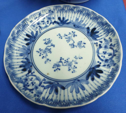 A rare and unusual late 18th or19th century  oriental blue and white hand painted porcelain cabinet plate with factory mark to base decorated with unusual bamboo and cherry blossom decoration. W.21 Cm.