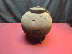 An Old Iron Cooking Pot with Lid on Legs incised. W.20 H.26 Cm.