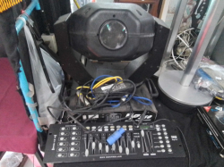 An Electric MP Disco Light and A DMX Controller. (Sold as seen)