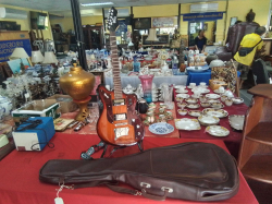 A Jet King Electric Guitar with Stand and Leather case.
