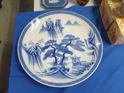 A lovely hand painted oriental blue and white porcelain charger/platter W.40 Cm. signed to the base