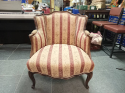 An Antique Armchair Crafted in the French Louis Style. Featuring carved walnut wood Frame and Striped Upholstery seating and backrests. ( A Minor A/F left arm) W.70 D.55 H.80 Cm. 