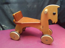A Vintage Wooden Toy Horse on Wheels. W.43 D.20 H.35 Cm.