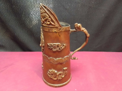 An antique Tibetan copper and brass Duomuhu ewer, a ceremonial vessel used in Buddhist ceremonies. W.13 H.22 Cm.